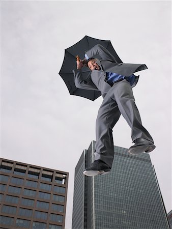 Businessman Falling, Holding Umbrella Stock Photo - Rights-Managed, Code: 700-00611215
