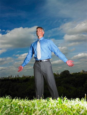 simsearch:700-00611221,k - Businessman Standing in Field With Open Arms Stock Photo - Rights-Managed, Code: 700-00611234