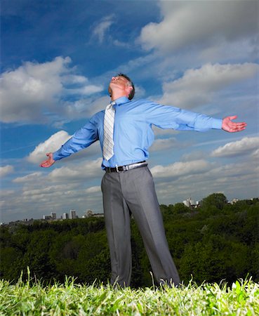 simsearch:700-00611221,k - Businessman Standing in Field With Arms Open Wide Stock Photo - Rights-Managed, Code: 700-00611233