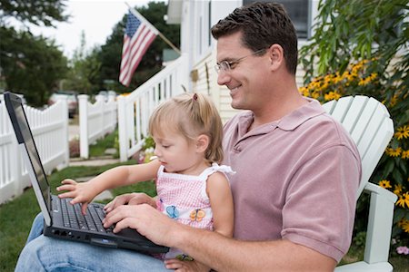 Father and Daughter with Laptop Outdoors Stock Photo - Rights-Managed, Code: 700-00623007
