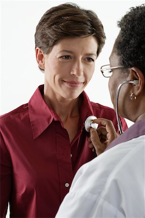 doctor woman heartbeat - Doctor Checking Patient's Heartbeat Stock Photo - Rights-Managed, Code: 700-00623047