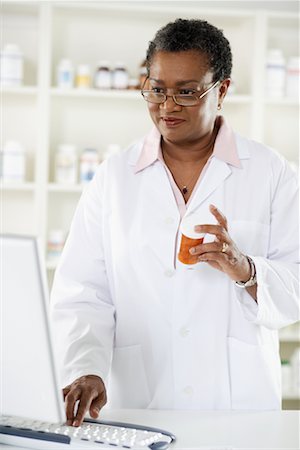 Pharmacist Using Computer Stock Photo - Rights-Managed, Code: 700-00623131