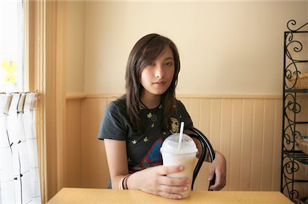 fruit milkshake in plastic cup - Woman in Restaurant with Milkshake Stock Photo - Rights-Managed, Code: 700-00623182