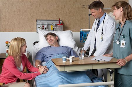doctor talking couple - Wife Visiting Husband in Hospital Stock Photo - Rights-Managed, Code: 700-00623297