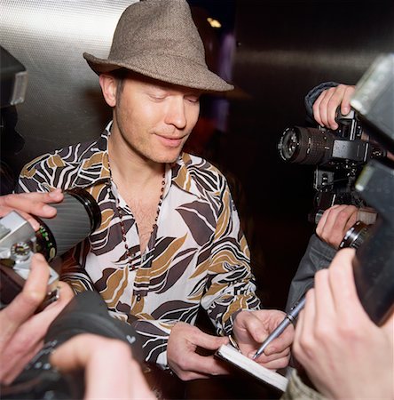 Man Signing Autographs Stock Photo - Rights-Managed, Code: 700-00634114