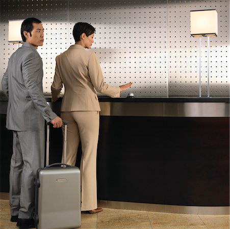 picture man at hotel desk checking in - Couple at Front Desk in Hotel Stock Photo - Rights-Managed, Code: 700-00635324