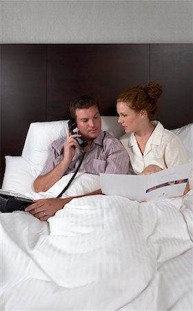 simsearch:700-00635374,k - Couple Ordering Room Service Stock Photo - Rights-Managed, Code: 700-00635370