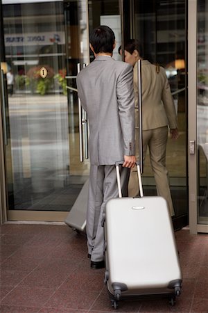 Couple Walking into Hotel Stock Photo - Rights-Managed, Code: 700-00635398