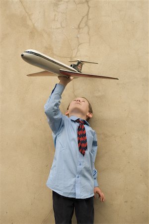 Boy Playing With Toy Airplane Stock Photo - Rights-Managed, Code: 700-00635836