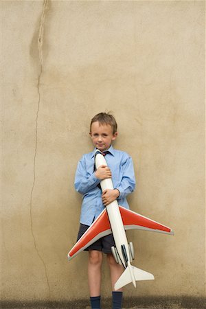 Boy Holding Toy Airplane Stock Photo - Rights-Managed, Code: 700-00635837