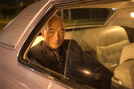 Portrait of Businessman In Backseat of Car Foto de stock - Con derechos protegidos, Código: 700-00635840