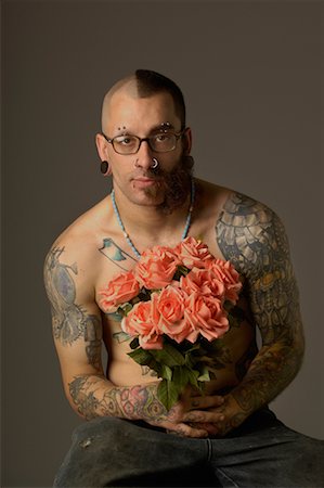 simsearch:673-02139064,k - Portrait of a Tattoed Man Holding A Bouquet of Roses Stock Photo - Rights-Managed, Code: 700-00635899