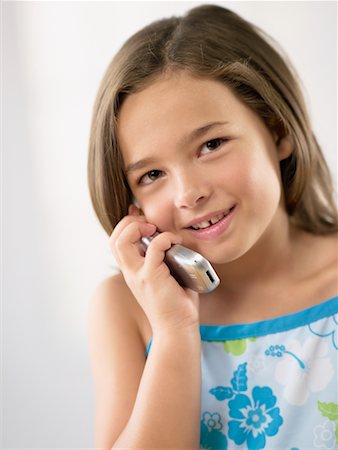 Girl Using Cellular Phone Stock Photo - Rights-Managed, Code: 700-00639619
