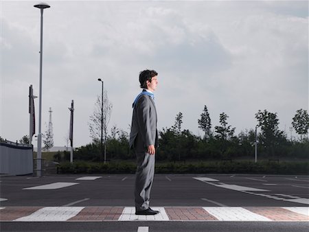 suit wind - Businessman Standing in Parking Lot Stock Photo - Rights-Managed, Code: 700-00644006