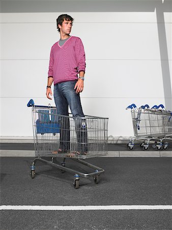 Man Standing in Grocery Cart Stock Photo - Rights-Managed, Code: 700-00644052