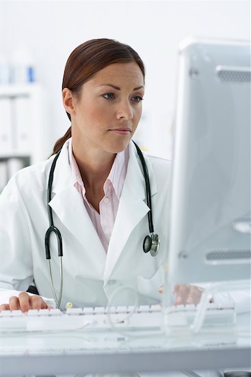 Doctor Working at Computer Stock Photo - Premium Rights-Managed, Artist: Jerzyworks, Image code: 700-00644237