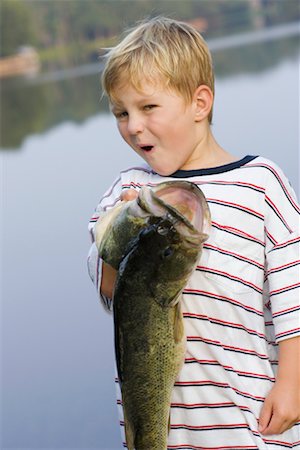 Boy Holding A Big Fish Stock Photo - Rights-Managed, Code: 700-00644310