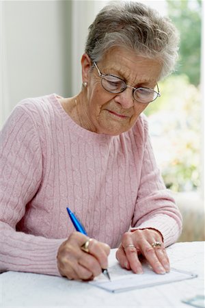 Woman Paying Bills Stock Photo - Rights-Managed, Code: 700-00649999