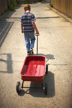 Boy Pulling Wagon Stock Photo - Rights-Managed, Code: 700-00649991