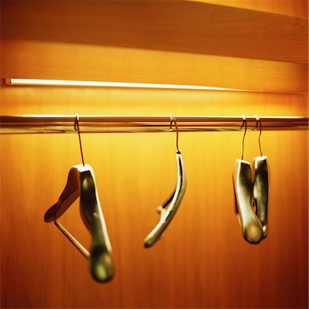 Clothes Hangers in Empty Closet Stock Photo - Rights-Managed, Code: 700-00641161