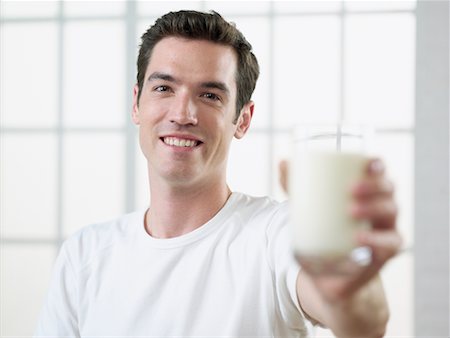 simsearch:700-00639623,k - Man Holding Out a Glass of Milk Stock Photo - Rights-Managed, Code: 700-00641936