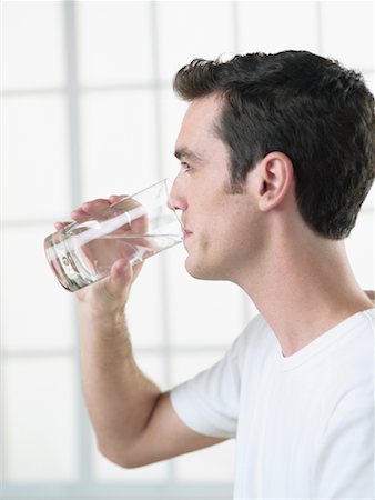 Man Drinking Glass of Water Stock Photo - Rights-Managed, Code: 700-00641937