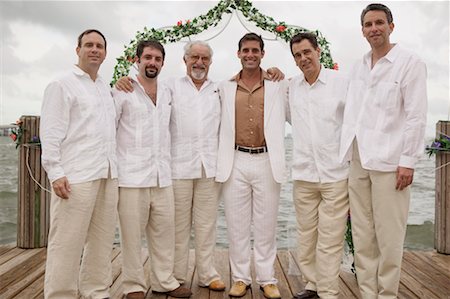 Portrait of Groom and Groomsmen Standing on Dock Foto de stock - Con derechos protegidos, Código: 700-00642529