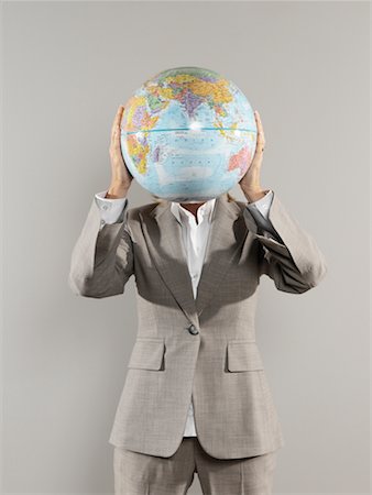 Portrait of Businesswoman Holding Globe Stock Photo - Rights-Managed, Code: 700-00659485