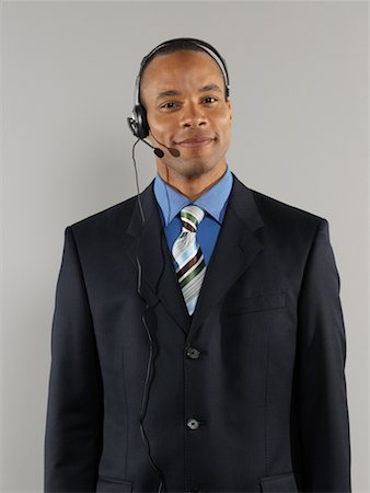 simsearch:700-01378659,k - Businessman Wearing Headset Stock Photo - Rights-Managed, Code: 700-00659517