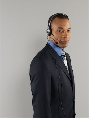 simsearch:700-01378659,k - Businessman Wearing Headset Stock Photo - Rights-Managed, Code: 700-00659518