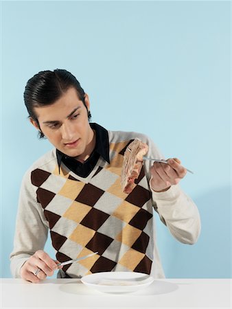 Portrait of Man Eating Steak Stock Photo - Rights-Managed, Code: 700-00659590