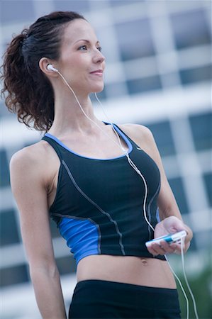 Woman Listening to MP3 Player Stock Photo - Rights-Managed, Code: 700-00651179