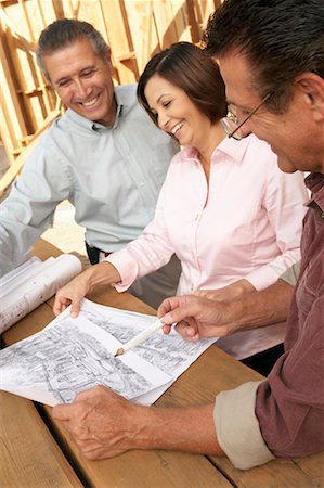 People Looking at Blueprint on Construction Site Stock Photo - Rights-Managed, Code: 700-00651185