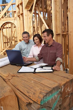People Looking at Blueprint on Construction Site Stock Photo - Rights-Managed, Code: 700-00651187