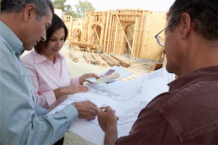 People Looking at Blueprint on Construction Site Stock Photo - Rights-Managed, Code: 700-00651191