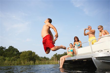 friends boat jumping - Teenager Jumping Stock Photo - Rights-Managed, Code: 700-00651344
