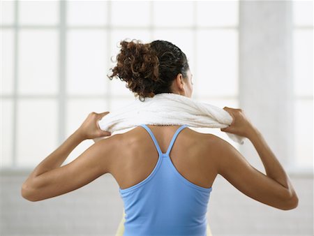Woman Holding Towel Around Neck Fotografie stock - Rights-Managed, Codice: 700-00651467