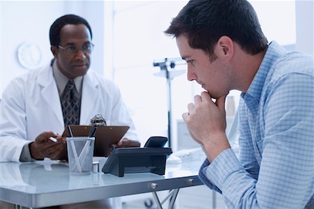 doctors reviewing medical records - Patient with Doctor Stock Photo - Rights-Managed, Code: 700-00661001