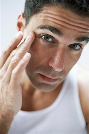 face cream male - Man Examining Face Stock Photo - Rights-Managed, Code: 700-00661123