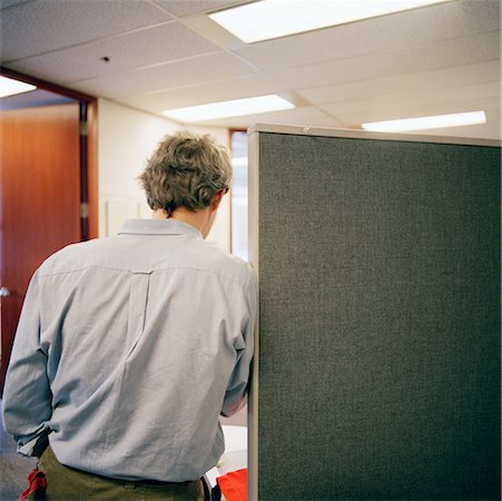 Man Leaning Against Cubicle Wall in Office Stock Photo - Rights-Managed, Code: 700-00661258