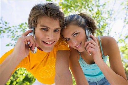 Portrait of Couple on Cell Phones Stock Photo - Rights-Managed, Code: 700-00661326