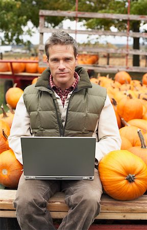 Man with Laptop at Farmer's Market Stock Photo - Rights-Managed, Code: 700-00684836