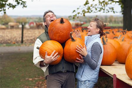 Couple Carrying Pumpkins Stock Photo - Rights-Managed, Code: 700-00684833