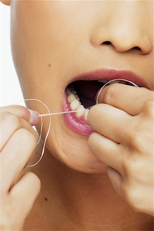 Woman Flossing Teeth Stock Photo - Rights-Managed, Code: 700-00688417