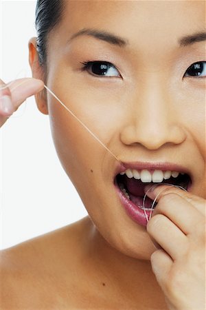 simsearch:700-00527879,k - Woman Flossing Teeth Stock Photo - Rights-Managed, Code: 700-00688418