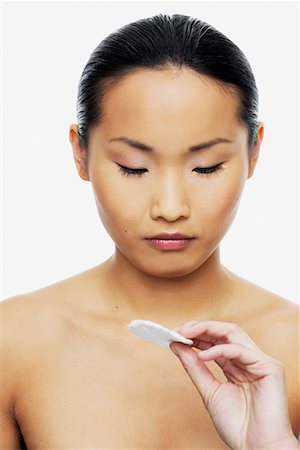 simsearch:700-01163584,k - Woman Holding Acne Pad Stock Photo - Rights-Managed, Code: 700-00688420