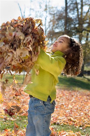 Girl Playing with Fall Leaves Stock Photo - Rights-Managed, Code: 700-00688579