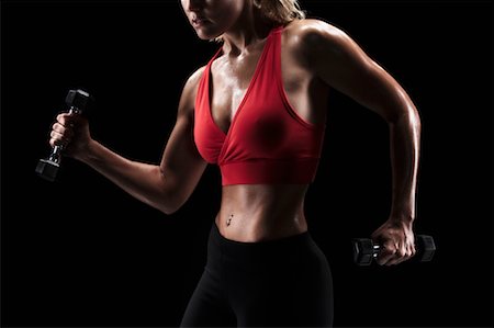 sweaty tank top - Woman Exercising with Weights Stock Photo - Rights-Managed, Code: 700-00688649