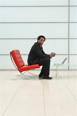 furniture salesperson - Businessman Sitting in Chair using Laptop Computer Stock Photo - Rights-Managed, Code: 700-00681372