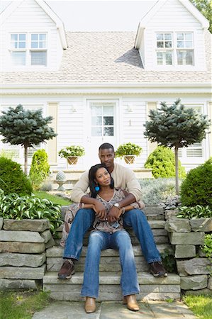 Man and Woman Sitting on Steps In Front of House Fotografie stock - Rights-Managed, Codice: 700-00681532